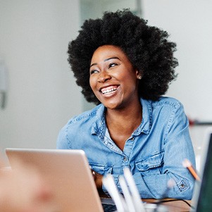 Woman smiling during work meeting in office