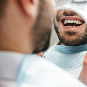 Patient looking at smile in reflection
