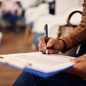 Patient filling out paperwork in lobby