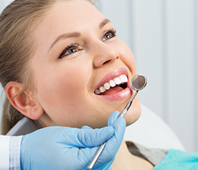 Woman receiving dental treatment