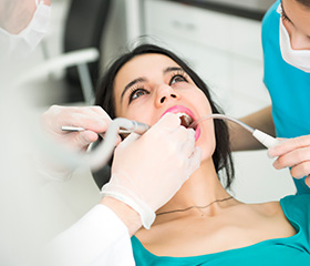 Woman receiving dental treatment