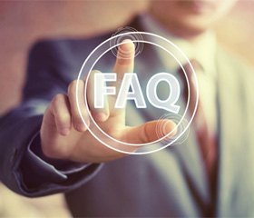 Man in business suit touching FAQ digital graphic