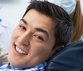 Smiling man in dental chair