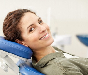 Dental patient smiling after successful implant salvage treatment