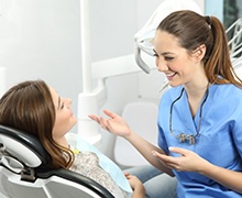 woman chatting with her dental hygienist 