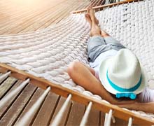 Patient relaxing in hammock after dental implant surgery in Port Orange