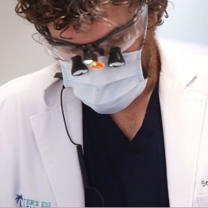 Close up of dentist looking down