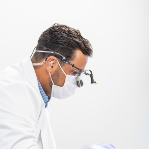 Close up of dentist looking down