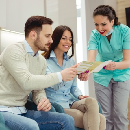 Dentist showing patients financial information