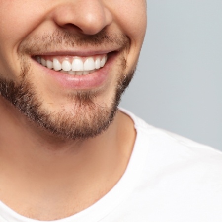 Close up of a bearded mans smile