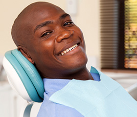 Smiling man in dental chair