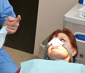 Woman with nitrous oxide nose mask