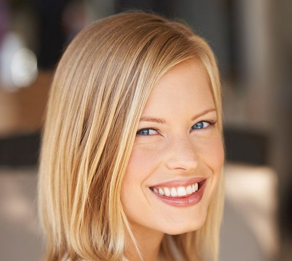 Young blonde woman smiling