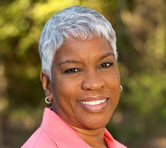 Senior woman smiling outdoors