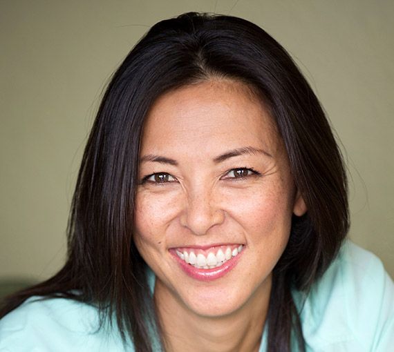 Young smiling woman wearing light green blouse