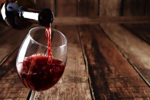 Red wine being poured in glass