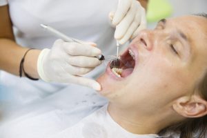 woman being treated for gum disease in Port Orange